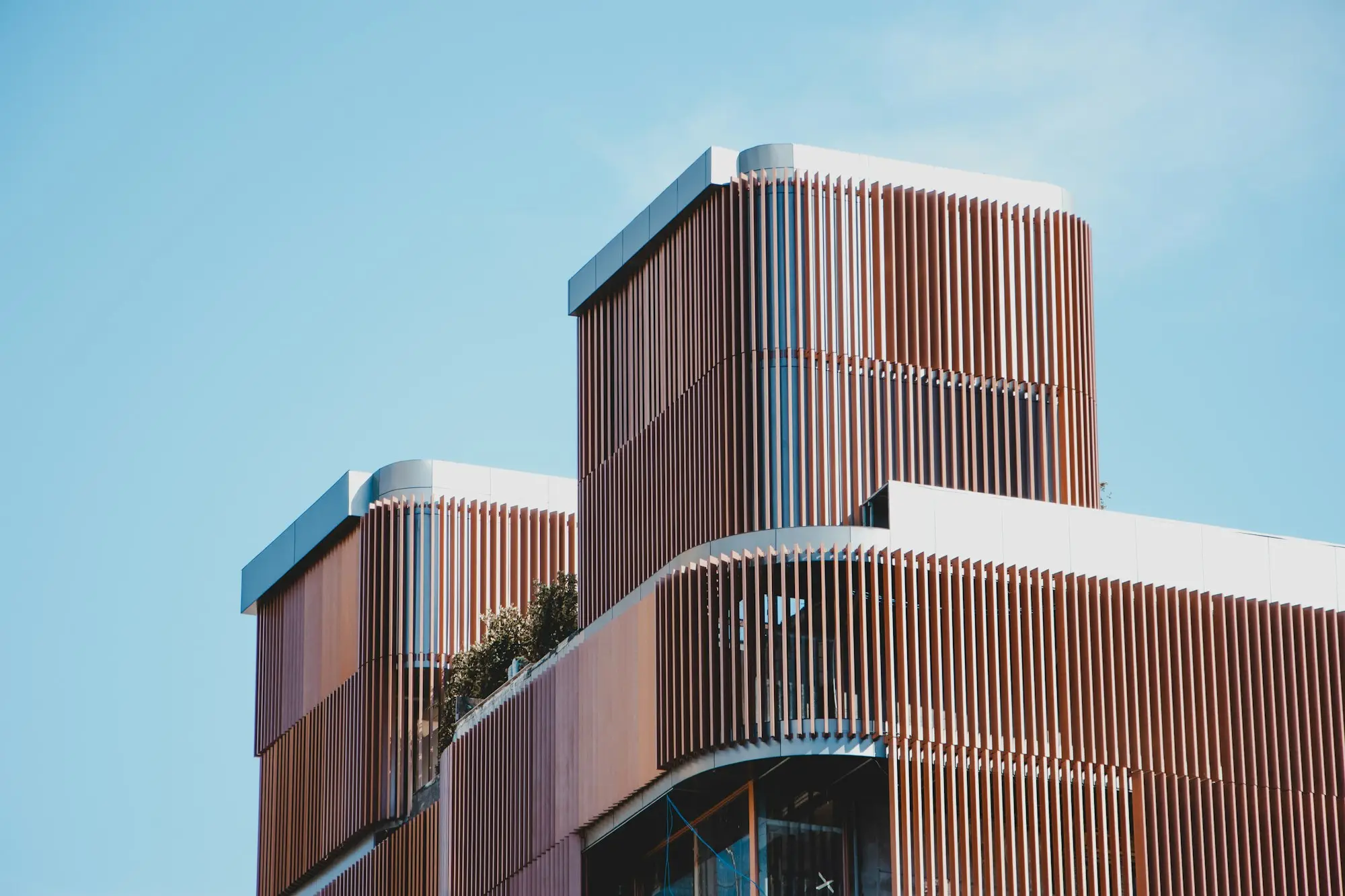 Modern low-rise commercial building with glass frontage in suburban Melbourne