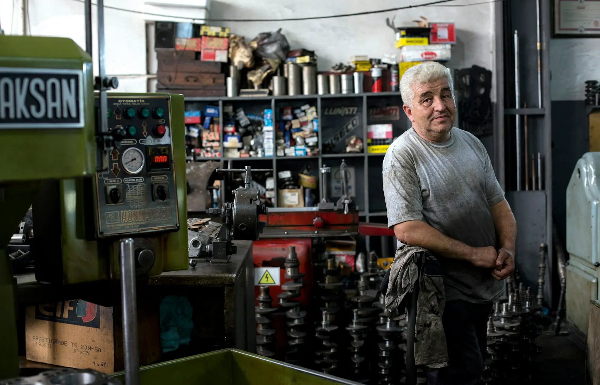 Machinist operating equipment on a small manufacturing floor in Adelaide