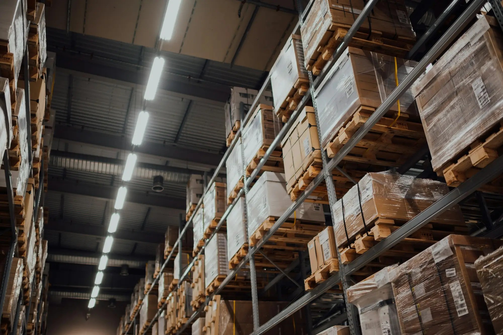 Rows of boxed stock on tall shelves in a Sydney wholesale distribution centre